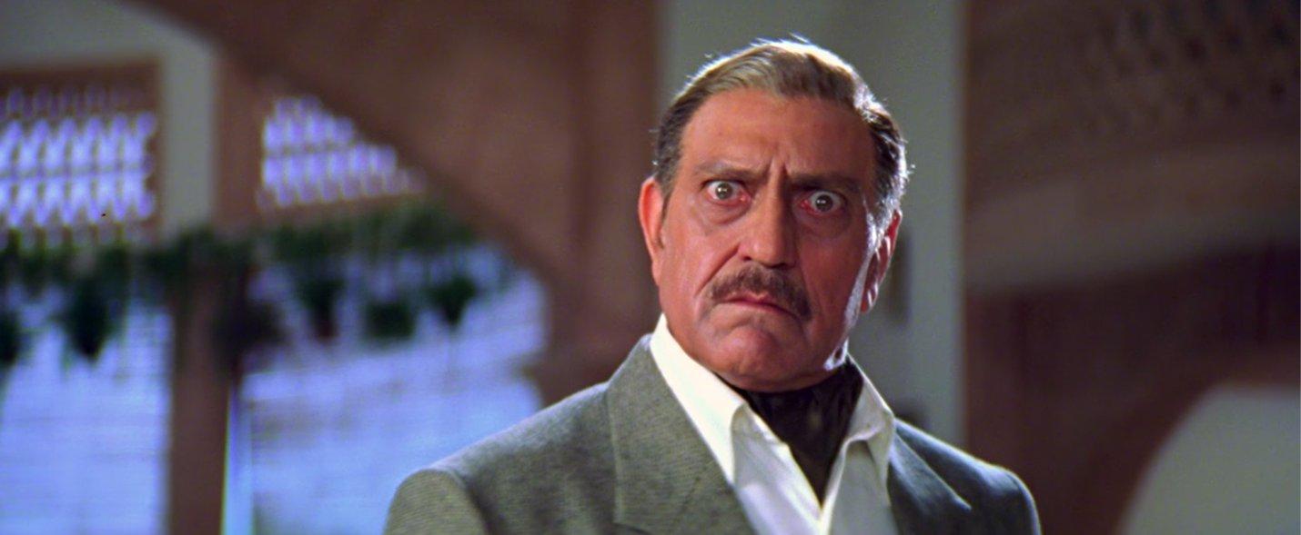 9. Whose father does Amrish Puri play in the film?