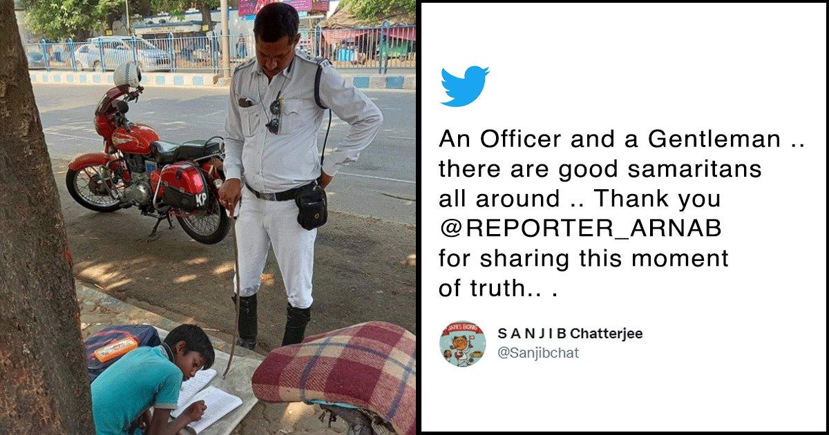 Kolkata Cop Hailed As Hero For Teaching A Homeless Kid While Managing Traffic
